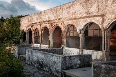 Low angle view of old building against sky