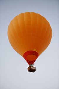 Low angle view of balloons against clear sky