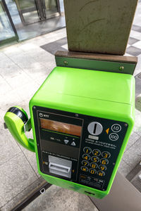 High angle view of telephone booth on table in city