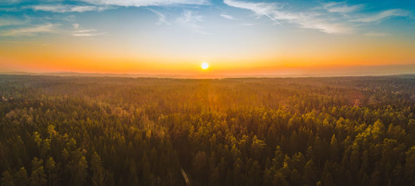 Scenic view of field against sky during sunset