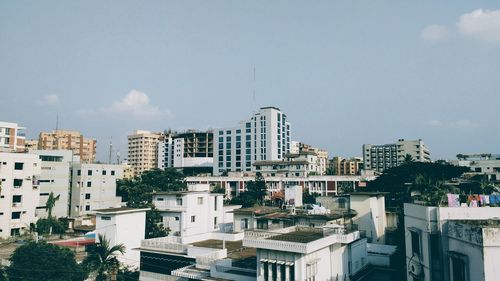 High angle view of buildings in city against sky