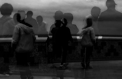 People standing in illuminated room