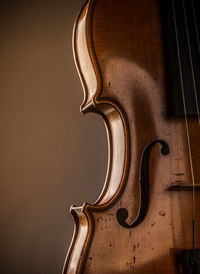 Close-up of violin against black background