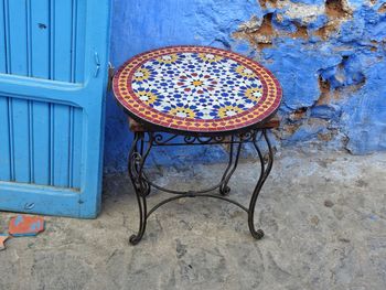 High angle view of patterned table against old wall