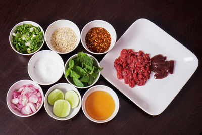 High angle view of chopped fruits in plate on table