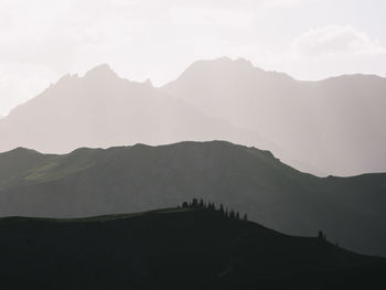 Silhouette mountains against sky