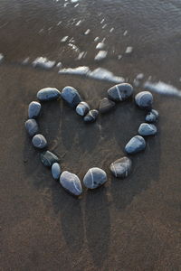 High angle view of stones on sand