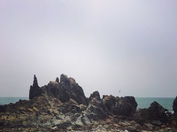 Scenic view of rocks against clear sky