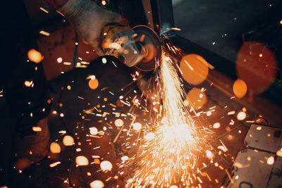 Close-up of person welding metal