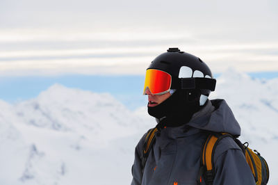 Rear view of man standing on snow