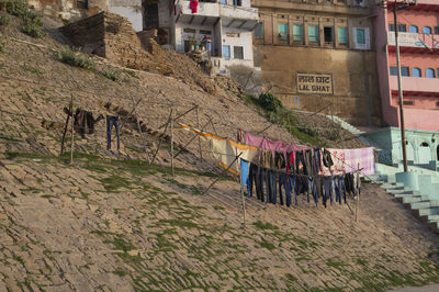 Clothes drying on clothesline outside building