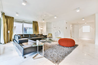 View of empty sofa and tables at home