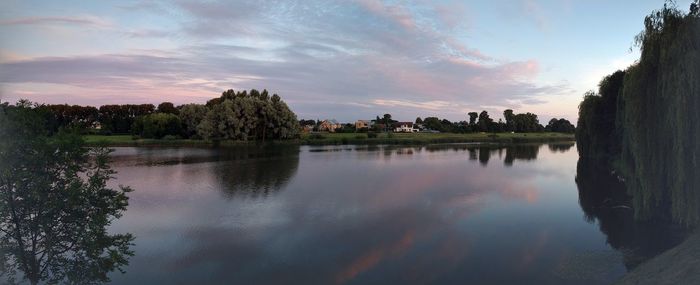 Scenic view of lake against sky during sunset