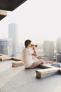 Man photographing cityscape