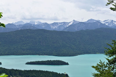 Scenic view of lake and mountains against sky