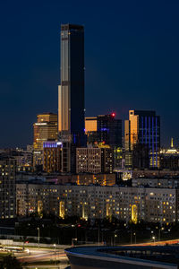 Illuminated buildings in city at night