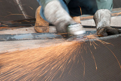 Low section of man working