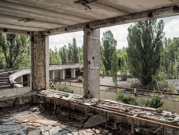 Abandoned building seen through broken window