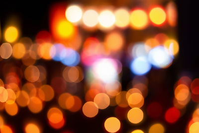 Defocused image of illuminated lights at night