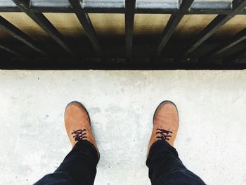 Low section of man standing on floor