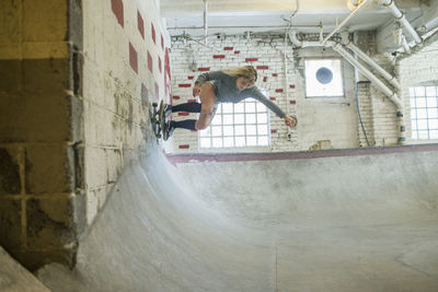 Young woman skateboarding.