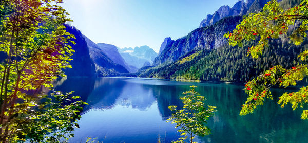 Scenic view of lake and mountains against sky