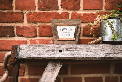Close-up of text on brick wall