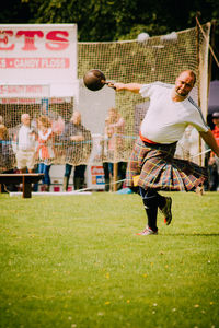 Playing soccer on field