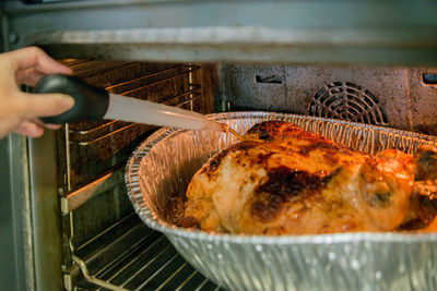 Cropped hand of person preparing food