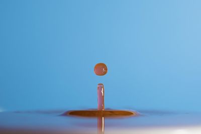 Close-up of balloons against blue sky