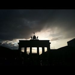 Low angle view of historical building against cloudy sky