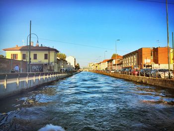 View of canal along buildings