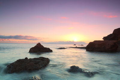 Scenic view of sea against sky during sunset