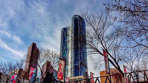 Low angle view of building against cloudy sky