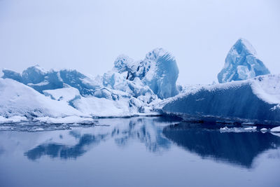 Scenic view of frozen lake against sky