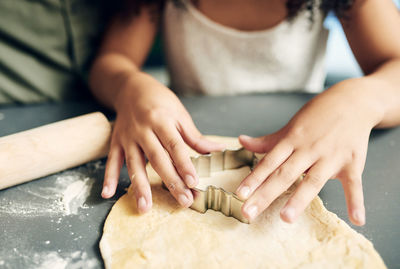 Midsection of woman preparing food on table