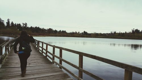 Man walking on pier