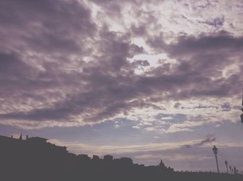 Low angle view of cloudy sky at sunset