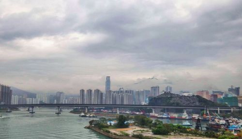 Cityscape against cloudy sky