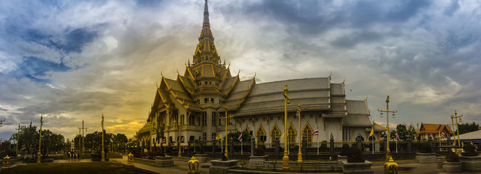 View of temple building against cloudy sky