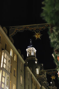 Low angle view of illuminated temple against sky at night