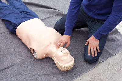 Midsection of man with figuring outdoors