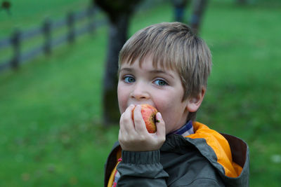 Portrait of boy eating food