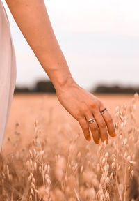 Midsection of woman holding flowers