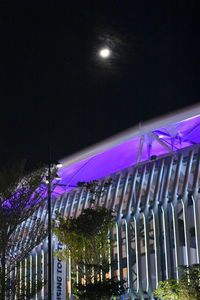 Low angle view of illuminated lights against clear sky at night