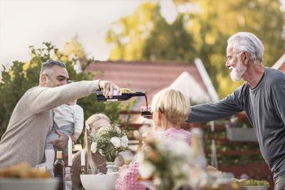 Family having meal in garden