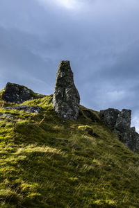 Rock formations on mountain against sky