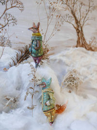 Close-up of figurine on snow