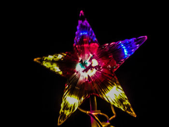 Low angle view of illuminated lights at night