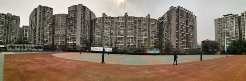 Modern buildings in city against sky